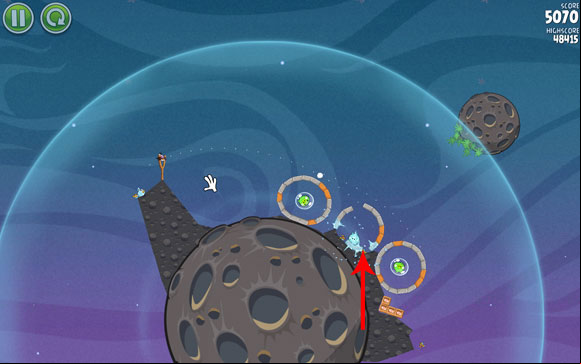 Launch the second bird on an almost identical trajectory (close to the first hoop), splitting just before it reaches the second hoop - Level 2-5 - Cold Cuts - Angry Birds Space - Game Guide and Walkthrough