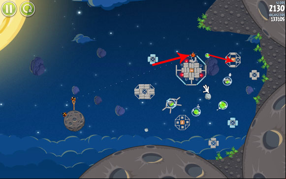 Launch the first bird at the pig which is flying above the cluster of concrete planks - Level 1-17 - Pig Bang - Angry Birds Space - Game Guide and Walkthrough