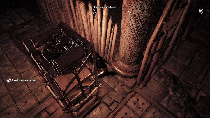 You have to move the shelf towards the wooden stakes blocking the pathway - AC Odyssey: Tombs in Argolis - Tombs - Assassins Creed Odyssey Guide