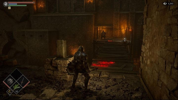 As you can see in the picture, a wooden bridge made of planks leads to the Official - Demons Souls Remake: Smithing Grounds(2-1) - walkthrough - Tunnel of the Stone Fang (Region 2) - Demons Souls Remake Guide