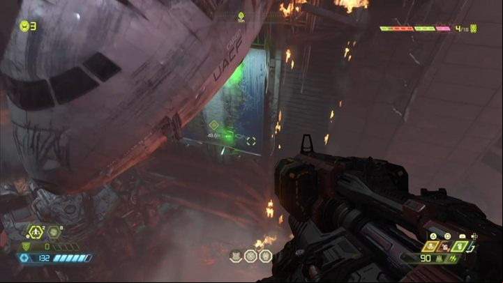 Eventually, you will reach the wreckage of a large plane - beneath it you will find a wall you can grab on - Doom Eternal: Arc Complex walkthrough - Levels walkthrough - Doom Eternal Guide
