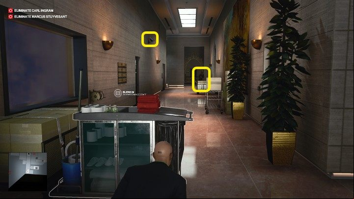The corridor is guarded by one guard and a camera mounted on the wall to the left - Hitman 3: How The Mighty Fall - Dubai, Mission Stories, walkthrough - On Top of the World - Dubai - Hitman 3 Guide