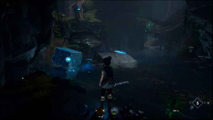 You'll be able to spot some shining rocks in the center of the cave once you reach the land on the left - Kena Bridge of Spirits: Adiras Regret - walkthrough - Walkthrough - Kena Bridge of Spirits Guide