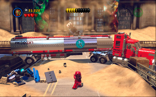 Approach to the next truck and use Iron Mans rocket attack - aim on the silver part of the vehicle and release the missiles - Sand Central Station | Walkthrough - Walkthrough - LEGO Marvel Super Heroes Game Guide & Walkthrough