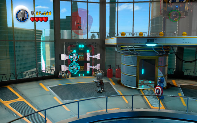 As Captain America cover yourself with a shield and through the flames - then head to the object located near to the wall and destroy it - Rebooted, Resuited | Walkthrough - Walkthrough - LEGO Marvel Super Heroes Game Guide & Walkthrough