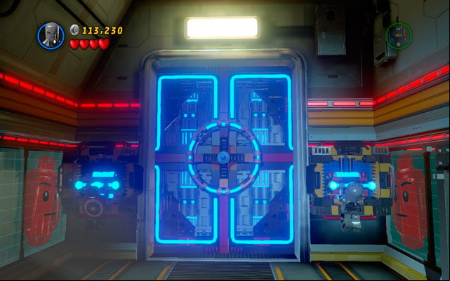 When the door is open, run towards the corridor and cover yourself with a shield - you will be targeted by another cannon - Rebooted, Resuited | Walkthrough - Walkthrough - LEGO Marvel Super Heroes Game Guide & Walkthrough