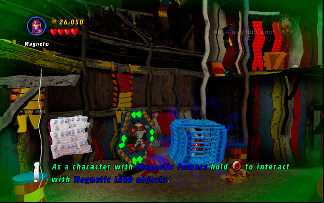 Choose Magneto to decompose the blue metal cage on the left side of the arena, then take the Attract Studs Deadpool Brick to collect coins - Stunt Show Surprise | Deadpool Bonus Missions: Collectables - Deadpool Bonus Missions: Collectables - LEGO Marvel Super Heroes Game Guide & Walkthrough