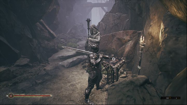 To unlock other weapons, you need to find locations with books and statues holding these items - Mortal Shell: Weapons - how many are available in the game? - FAQ - Mortal Shell Guide, Walkthrough