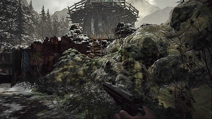 Walk along the narrow path until you reach another slime barrier - Resident Evil Village: Going through the village to the boat - walkthrough - Fortress - Resident Evil Village Guide