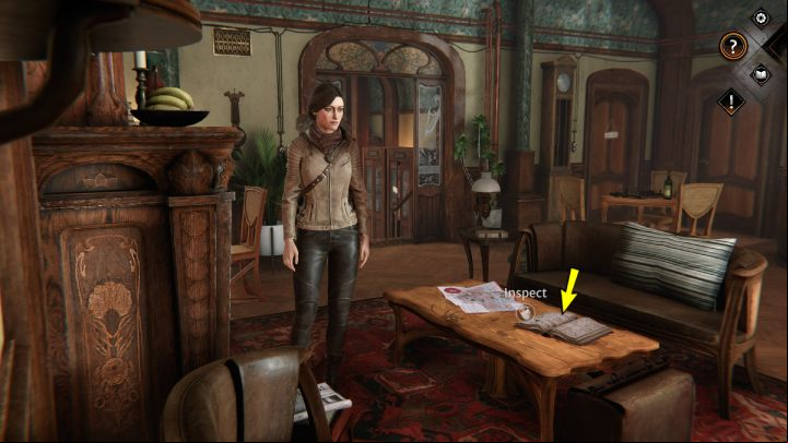 Approach the table and examine the phone book - Syberia The World Before: Vaghen - flower district, autumn 2005 part 1 - walkthrough - Walkthrough - Syberia The World Before Guide