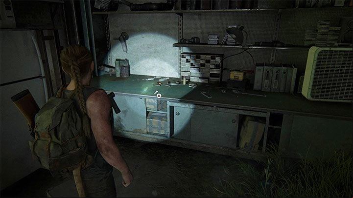 The workshop is in a dimly lit space in the hangar - The Last of Us 2: On Foot - collectibles, artefacts, coins - Seattle Day 1 - Abby - The Last of Us 2 Guide